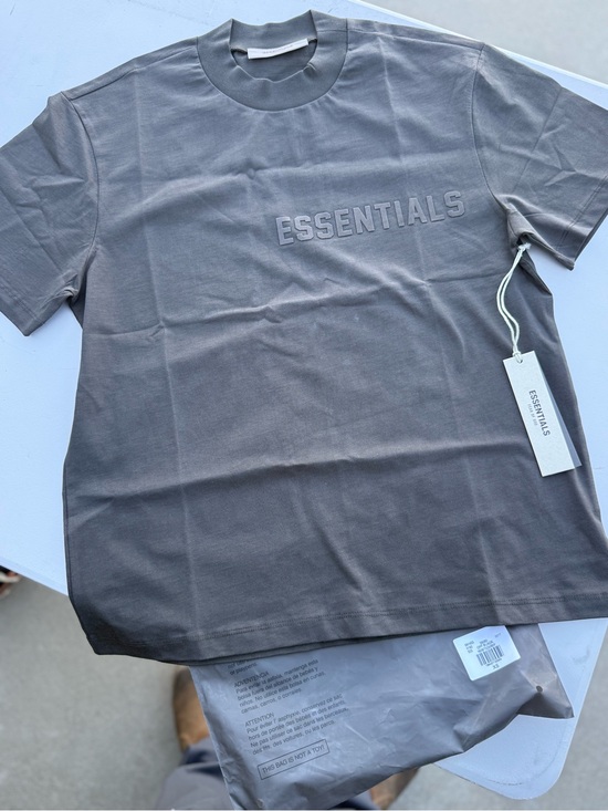 Essentials Other - ESSENTIALS Logo Tee in Off black